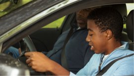 Photo of teen learning to drive