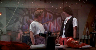 Bill and Ted playing air guitar iconically